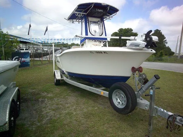 Slide: The Image of 2016 NauticStar 19 XS boat on trailer outdoors. - 3