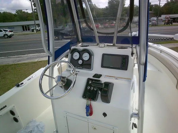 Slide: The Image of 2016 NauticStar 19 XS boat console with steering wheel and instruments. - 6