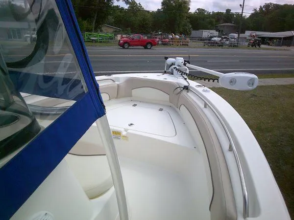 Slide: The Image of 2016 NauticStar 19 XS boat with blue canopy, parked roadside. - 7