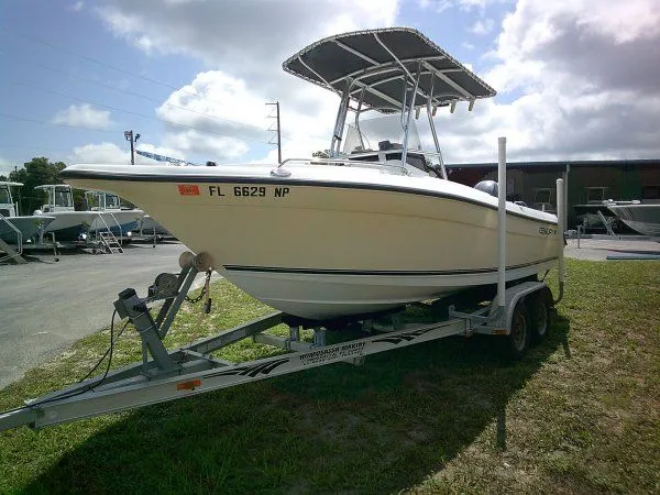 The Image of Century 2001SV boat from 2007 on trailer outdoors. - 1