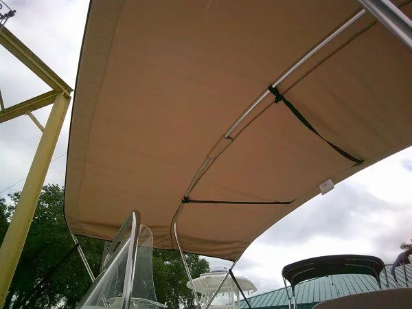 Slide: The Image of Tidewater 1910 Bay Max 2016 with Bimini top, side view. - 8