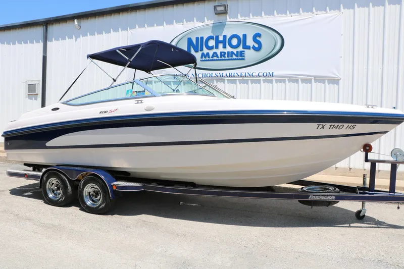 The Image of 1996 Chaparral 2330 SS boat on trailer at Nichols Marine dealership. - 1