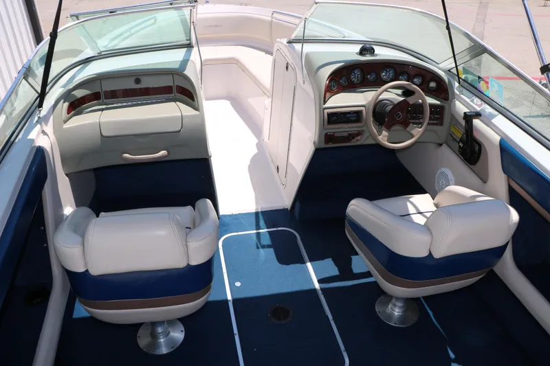 Slide: The Image of Interior of a 1996 Chaparral 2330 SS boat with blue and white seating. - 14