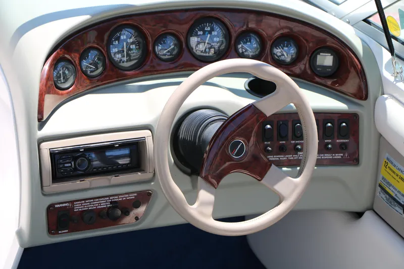 Slide: The Image of 1996 Chaparral 2330 SS boat dashboard with steering wheel and instrument panel. - 16