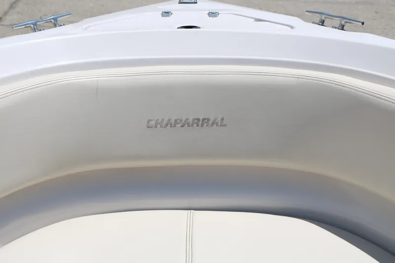 Slide: The Image of 1996 Chaparral 2330 SS boat interior with embossed logo on white seating. - 20
