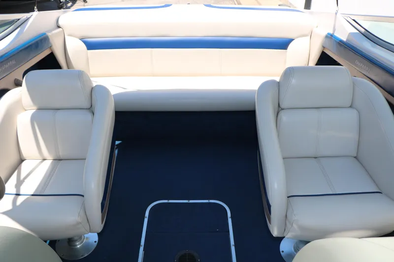 Slide: The Image of Interior of a 1996 Chaparral 2330 SS boat with white and blue seating. - 28