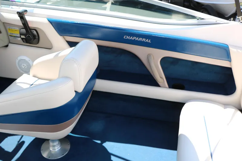 Slide: The Image of Interior of a 1996 Chaparral 2330 SS boat with blue and white seating. - 30
