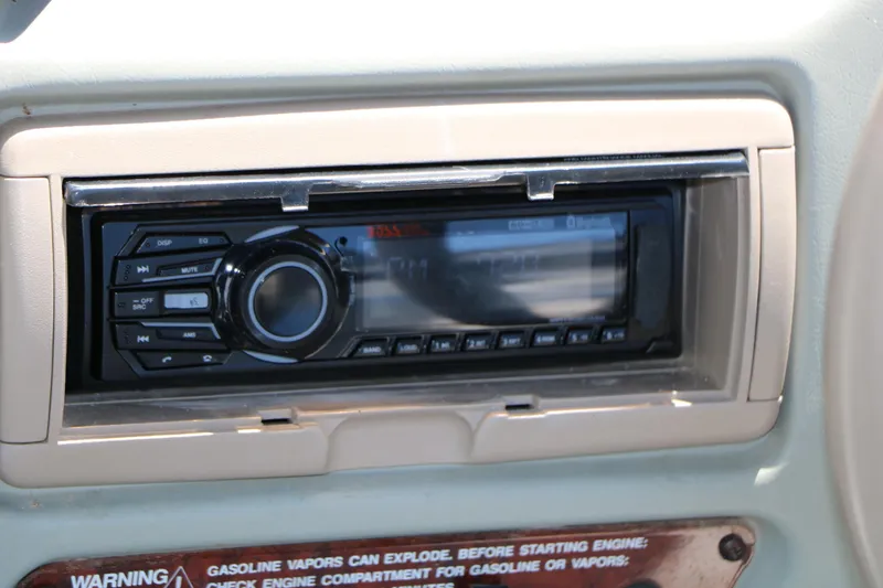 Slide: The Image of 1996 Chaparral 2330 SS boat stereo system with warning label. - 33