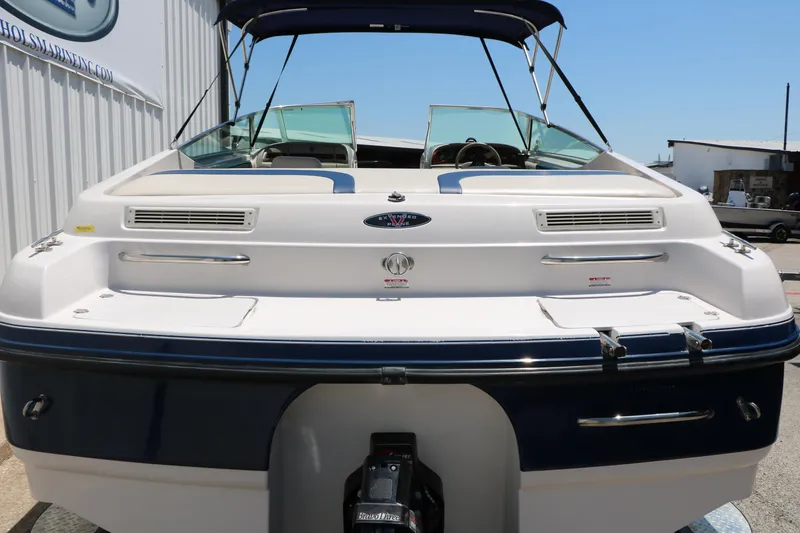 Slide: The Image of 1996 Chaparral 2330 SS boat, rear view, showcasing sleek design and spacious deck. - 8
