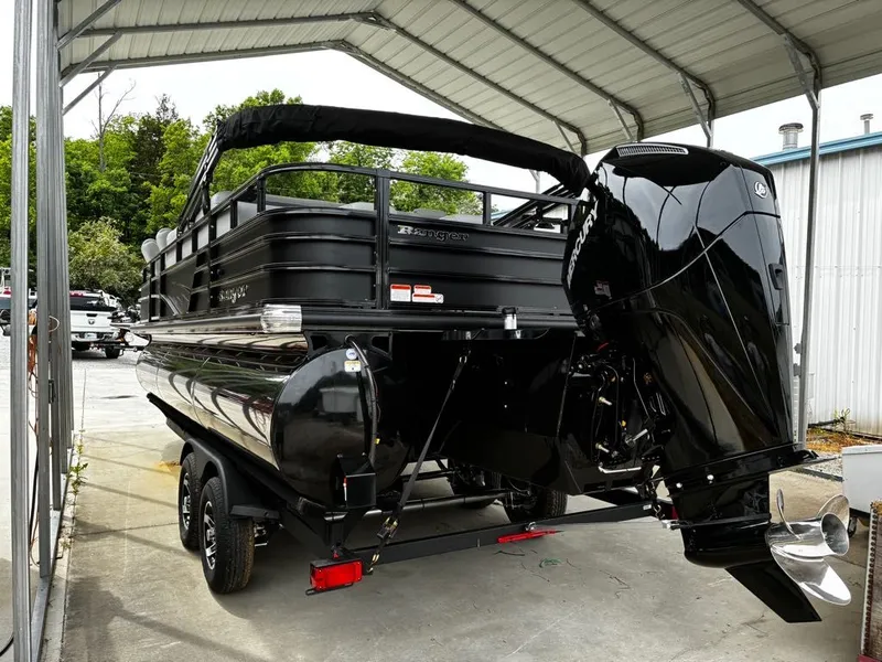 The Image of 2026 Ranger 223FC pontoon boat with black outboard motor. - 1