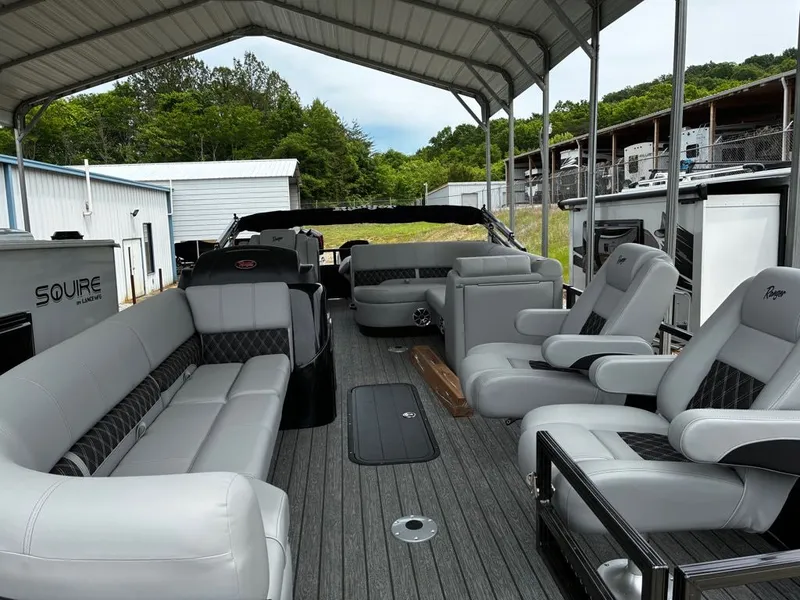 Slide: The Image of Interior of a 2026 Ranger 223FC pontoon boat with luxurious seating. - 11