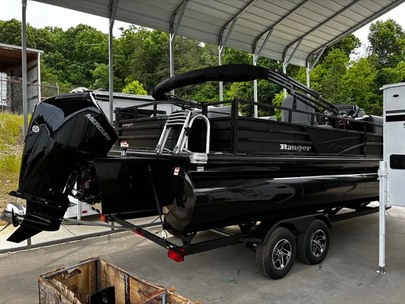 Slide: The Image of Black 2026 Ranger 223FC boat under a carport. - 5