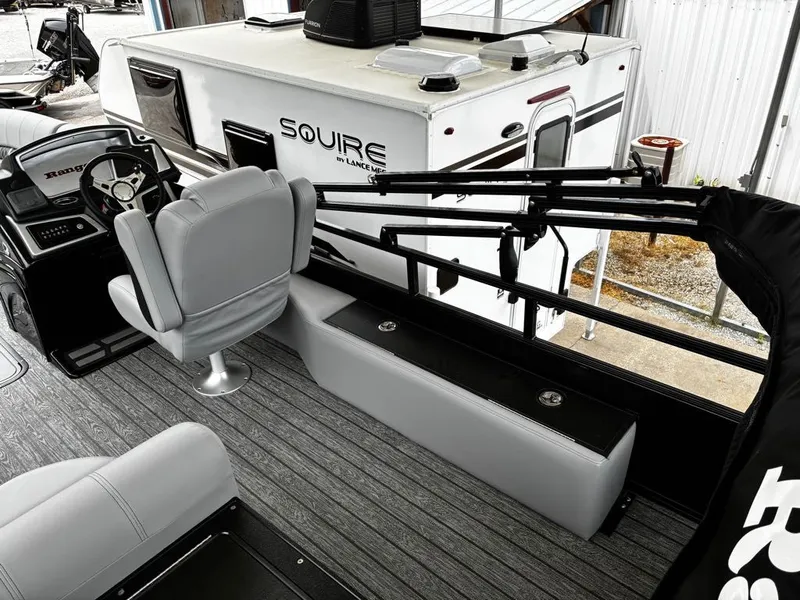 Slide: The Image of Interior of a 2026 Ranger 223FC boat with gray seating. - 6