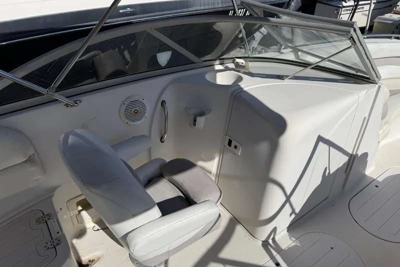 Slide: The Image of 2005 Starcraft Aurora 2210 OB boat interior with helm seat and windshield. - 11