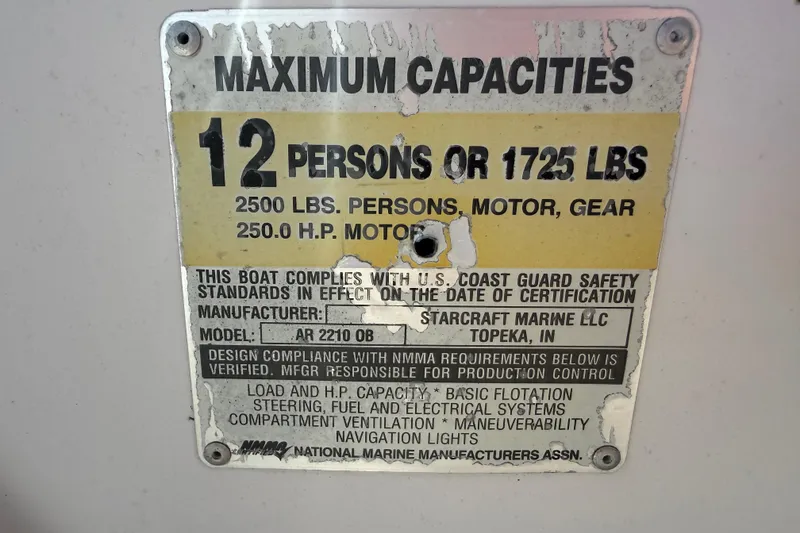 Slide: The Image of Capacity plate for 2005 Starcraft Aurora 2210 OB, 12 persons or 1725 lbs. - 14