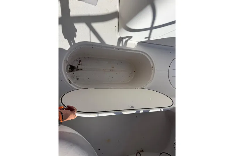 Slide: The Image of Open storage compartment on 2005 Starcraft Aurora 2210 OB boat. - 15