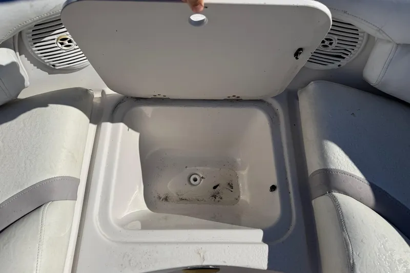 Slide: The Image of Open storage compartment on 2005 Starcraft Aurora 2210 OB boat, showing interior details. - 21