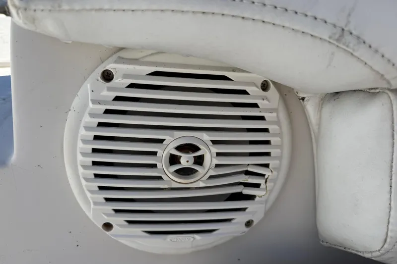 Slide: The Image of Close-up of a white speaker on a 2005 Starcraft Aurora 2210 OB boat. - 22
