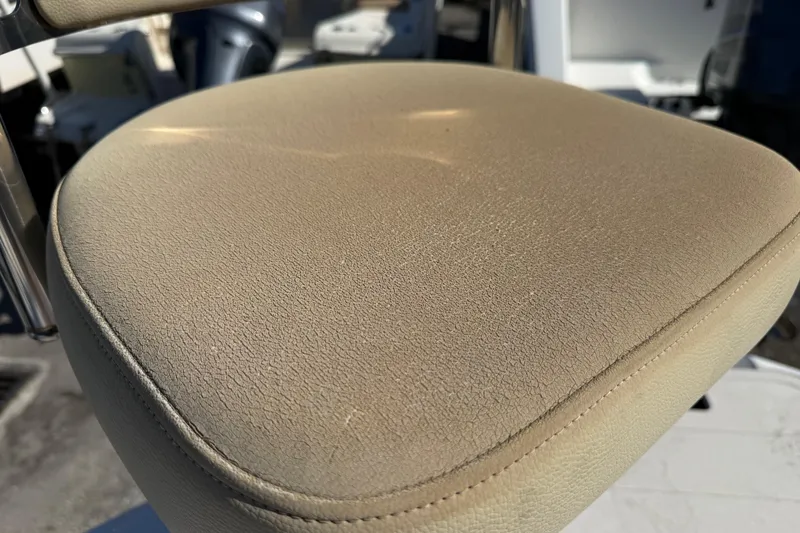 Slide: The Image of Close-up of a beige boat seat on a 2005 Starcraft Aurora 2210 OB. - 23
