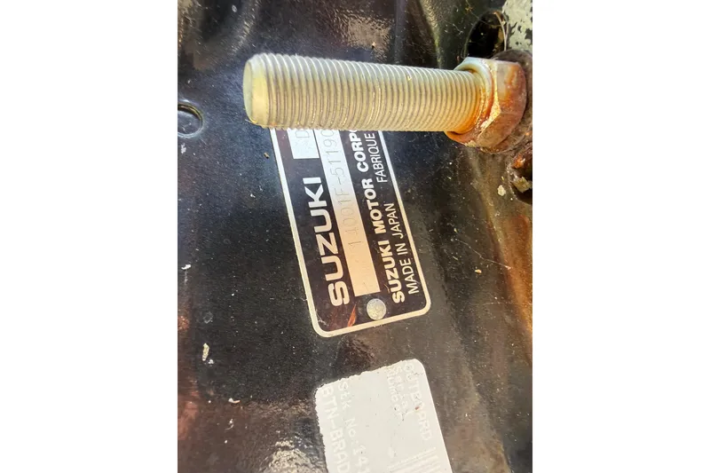 Slide: The Image of Close-up of a Suzuki motor label on a 2005 Starcraft Aurora 2210 OB. - 29