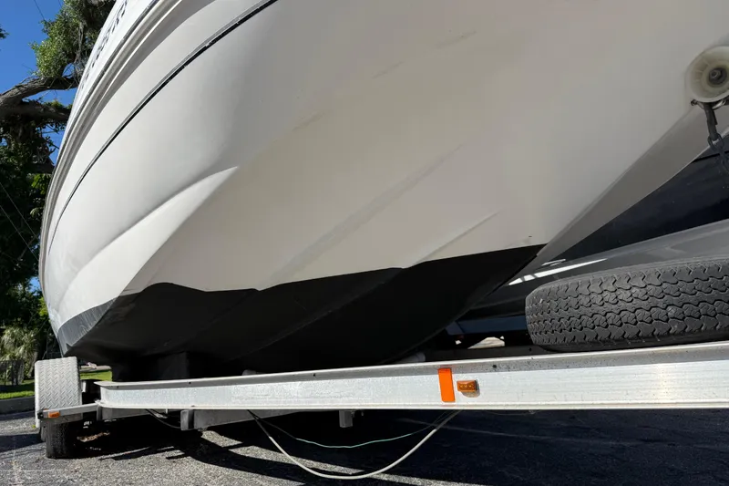 Slide: The Image of 2005 Starcraft Aurora 2210 OB boat on trailer, viewed from below. - 3