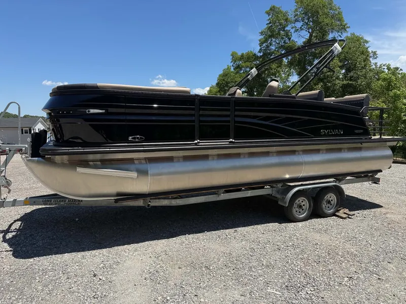 Slide: The Image of 2026 Sylvan L-3 DLZ Platnium pontoon boat on trailer. - 23