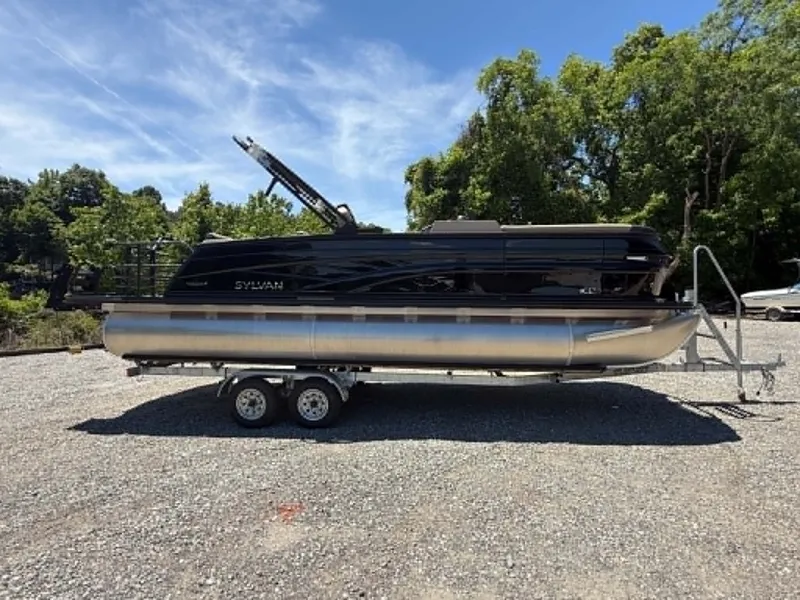 Slide: The Image of 2026 Sylvan L-3 DLZ Platnium pontoon boat on trailer. - 34