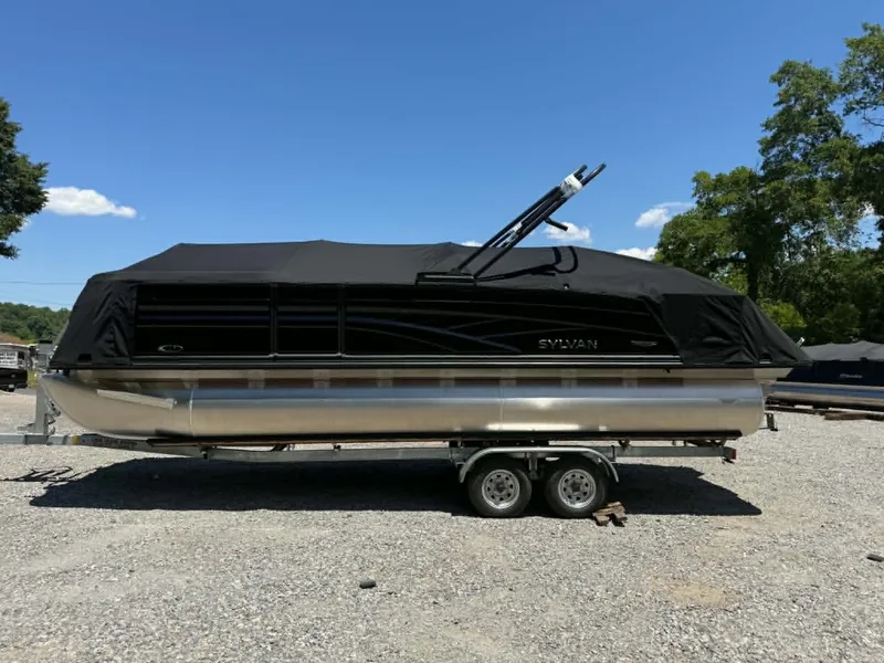 Slide: The Image of 2026 Sylvan L-3 DLZ Platinum pontoon boat on trailer. - 7