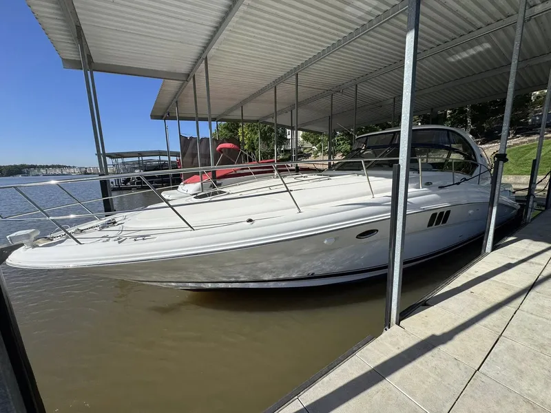 The Image of 2008 Sea Ray 44 Sundancer yacht docked, side view. - 1