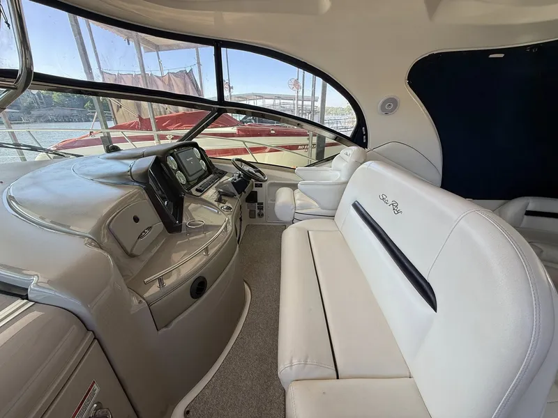 Slide: The Image of Interior of a 2008 Sea Ray 44 Sundancer yacht with white leather seating. - 10