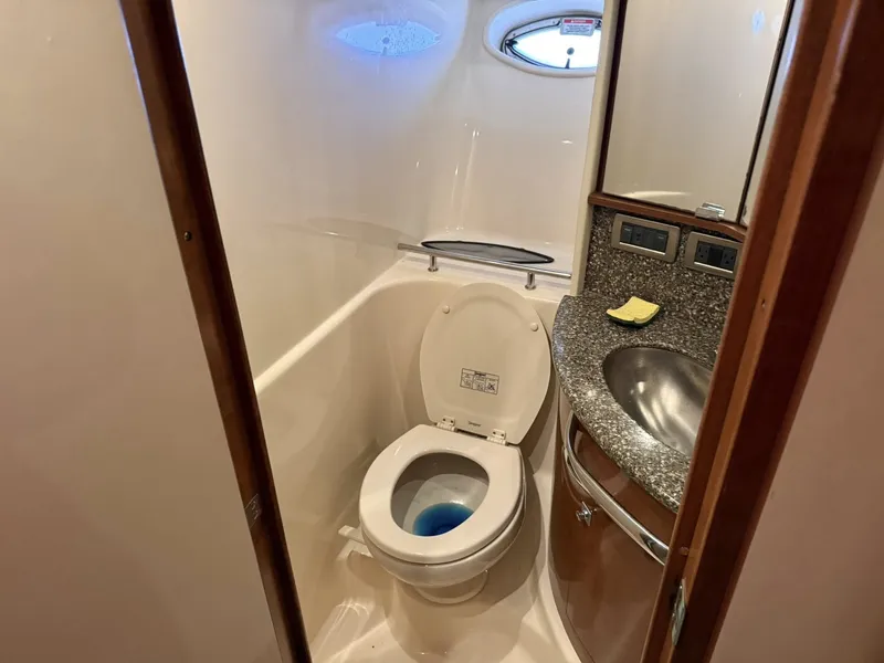 Slide: The Image of Sea Ray 44 Sundancer 2008 bathroom with toilet and sink. - 14