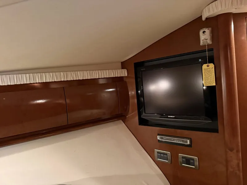 Slide: The Image of Interior of 2008 Sea Ray 44 Sundancer with TV and wood paneling. - 23