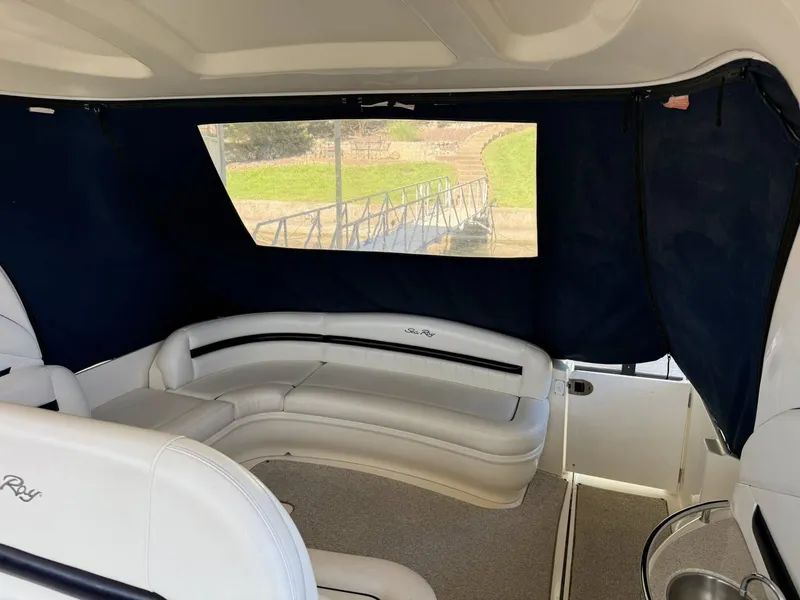 Slide: The Image of Interior of a 2008 Sea Ray 44 Sundancer with white leather seating. - 26