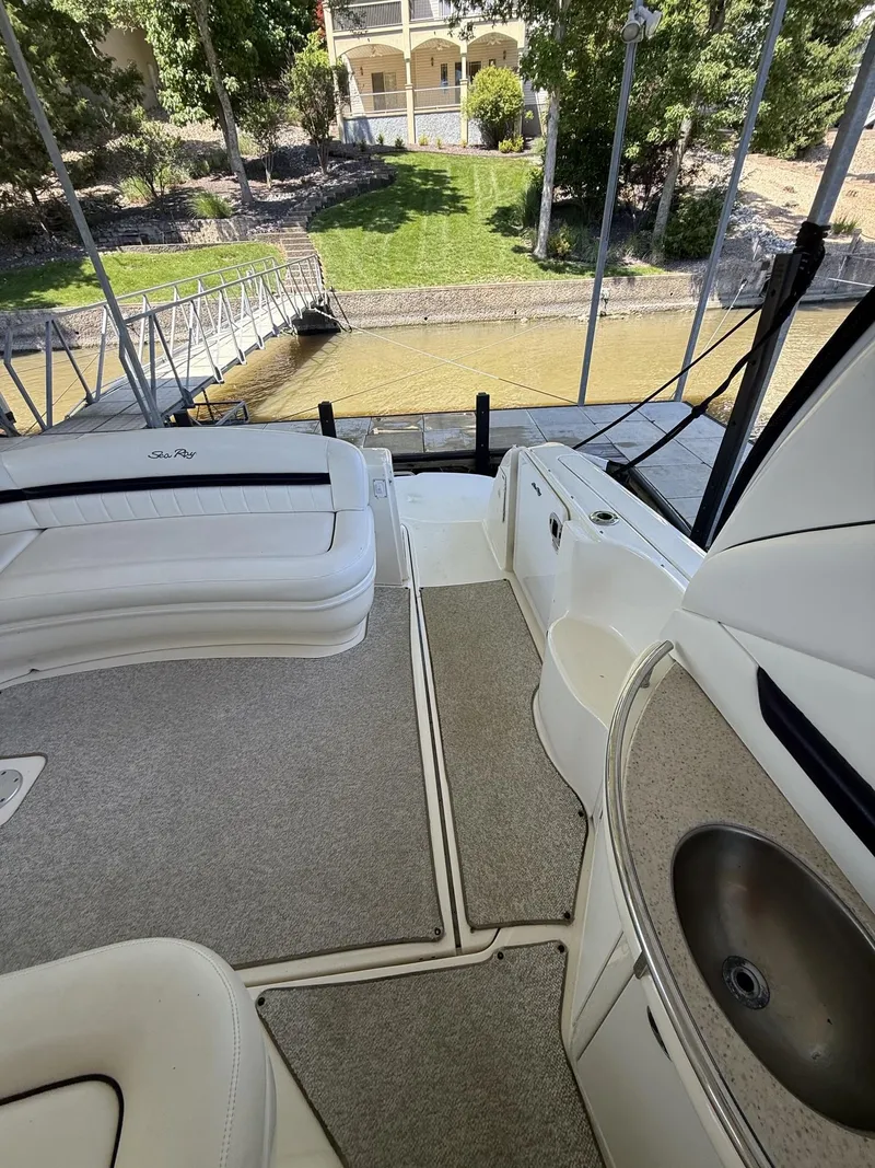 Slide: The Image of Interior of a 2008 Sea Ray 44 Sundancer yacht with seating and sink. - 29