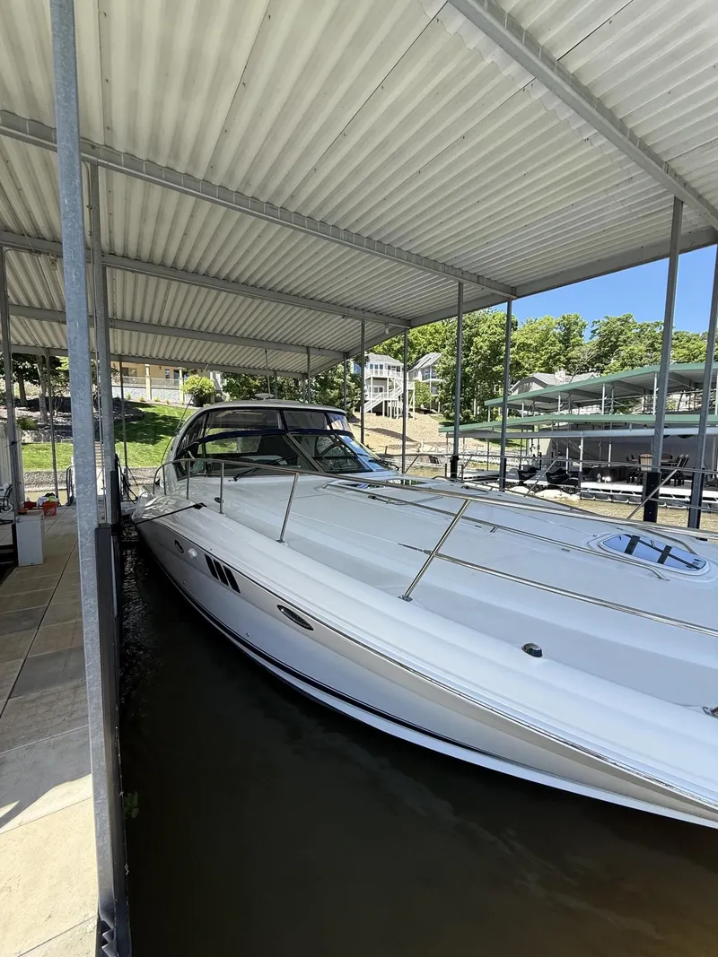 Slide: The Image of 2008 Sea Ray 44 Sundancer yacht docked under a canopy. - 3