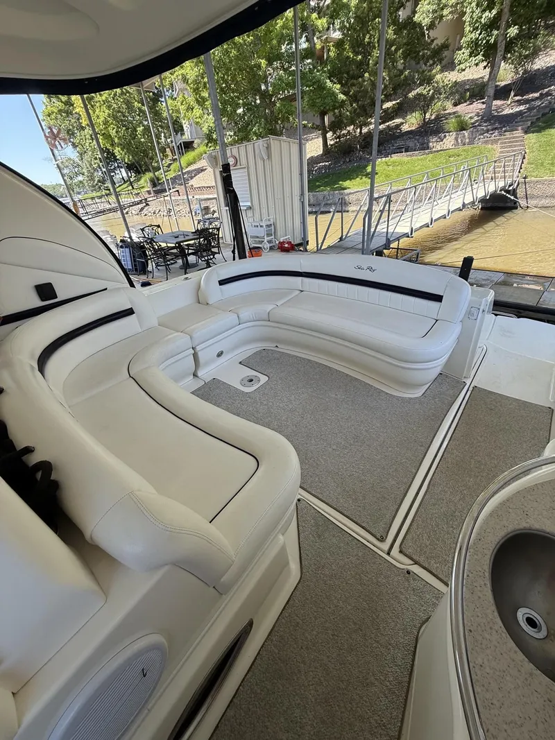 Slide: The Image of Interior of a 2008 Sea Ray 44 Sundancer yacht with white leather seating. - 32