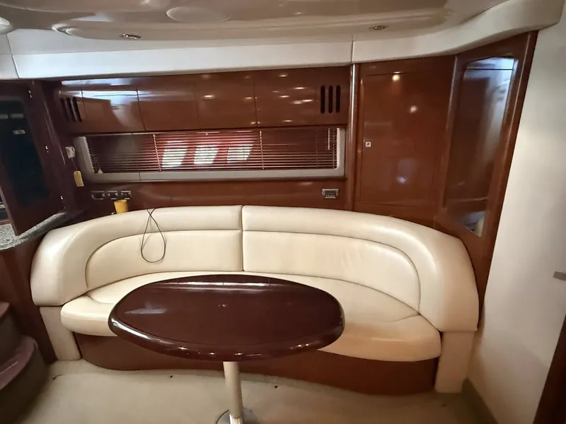 Slide: The Image of Interior of 2008 Sea Ray 44 Sundancer with leather sofa and wooden table. - 7