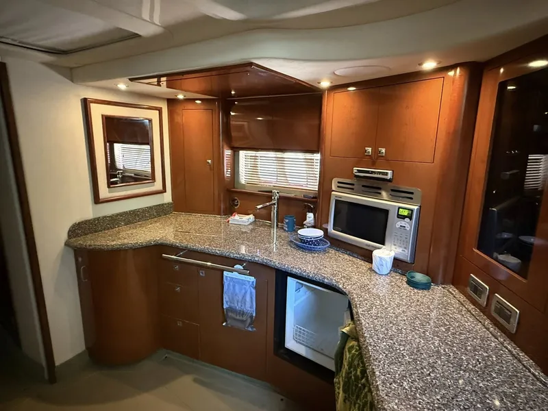 Slide: The Image of Interior of 2008 Sea Ray 44 Sundancer featuring modern kitchen. - 9