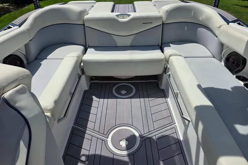 Slide: The Image of 2019 MasterCraft XT23 boat interior with luxurious seating and modern design. - 11