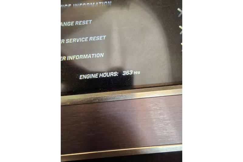 Slide: The Image of Display screen showing 363 engine hours on a 2019 MasterCraft XT23 boat. - 21