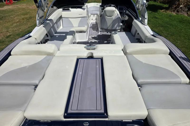 Slide: The Image of 2019 MasterCraft XT23 boat interior with spacious seating and modern design. - 8