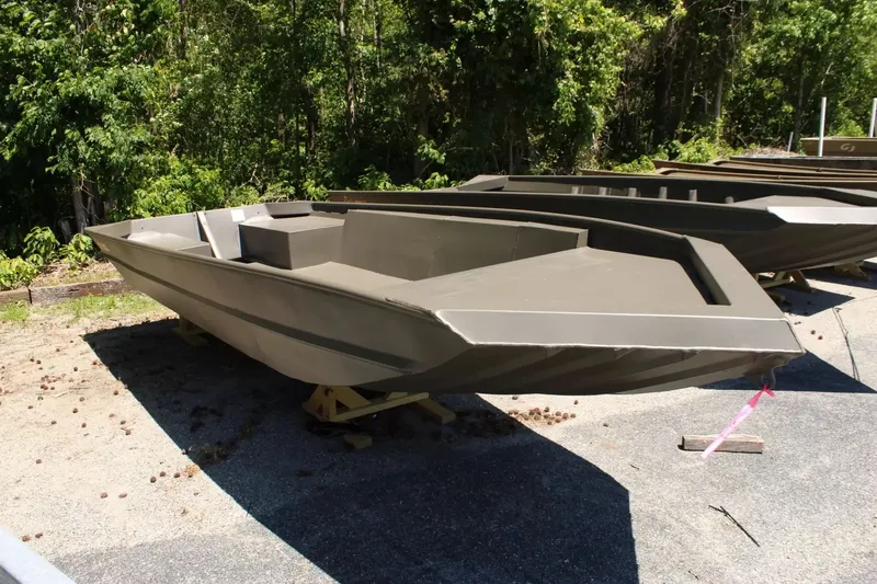 Slide: The Image of 2026 WeldBilt 1652V aluminum boat parked outdoors. - 3