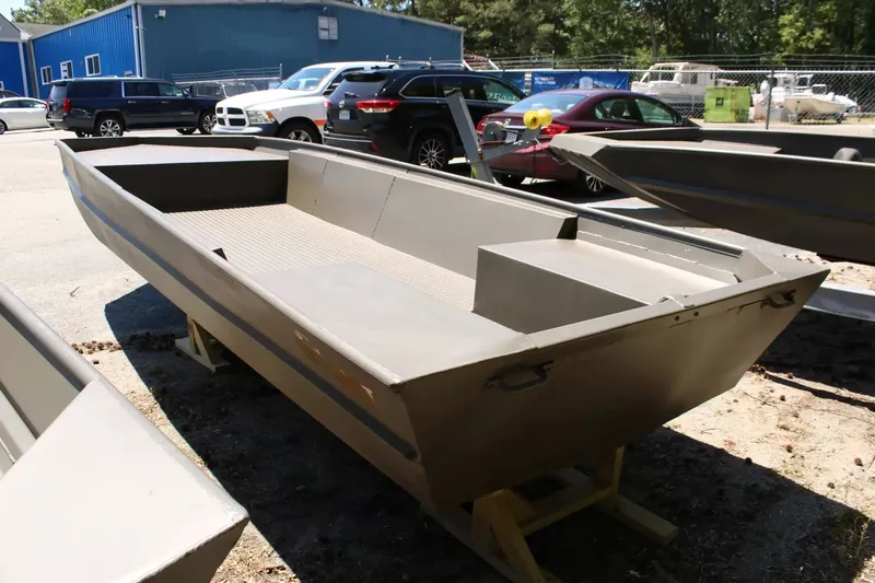 Slide: The Image of WeldBilt 1652V 2026 aluminum boat on a parking lot. - 6