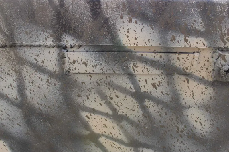 Slide: The Image of Close-up of camouflaged WeldBilt 1660V boat, year 2026. - 13