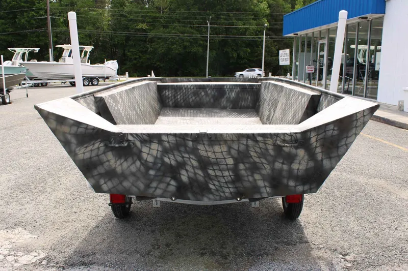 Slide: The Image of WeldBilt 1660V 2026 aluminum boat on parking lot outside store. - 9