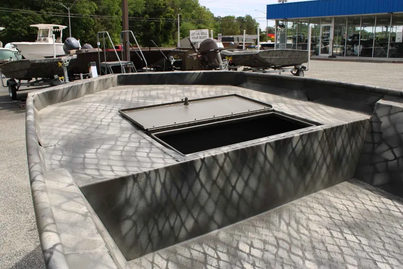 Slide: The Image of 2026 WeldBilt 1552V boat with open storage hatch. - 12