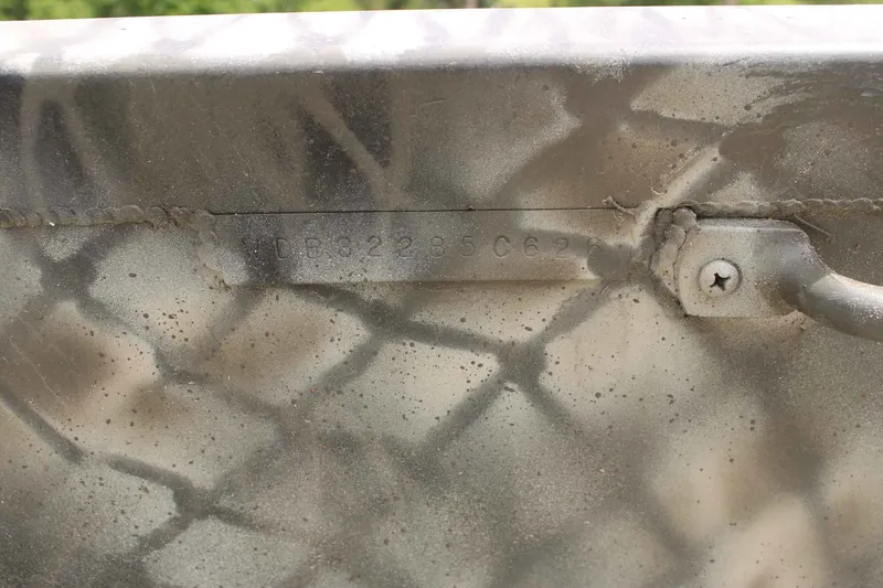 Slide: The Image of Close-up of serial number on a 2026 WeldBilt 1552V boat. - 14