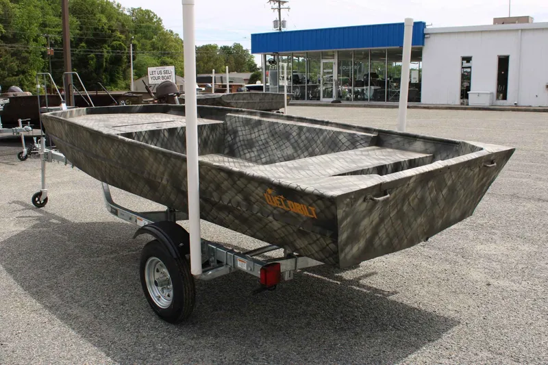 Slide: The Image of 2026 WeldBilt 1552V boat on trailer outdoors. - 3