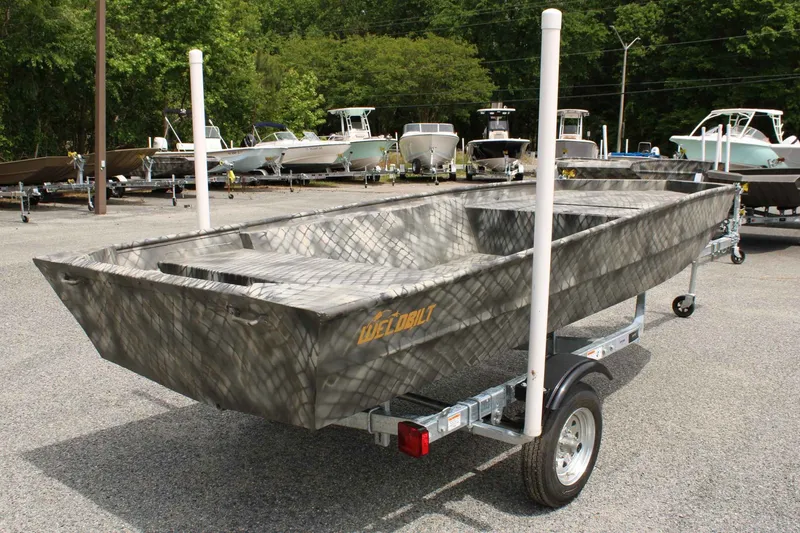 Slide: The Image of 2026 WeldBilt 1552V boat on trailer outdoors. - 5