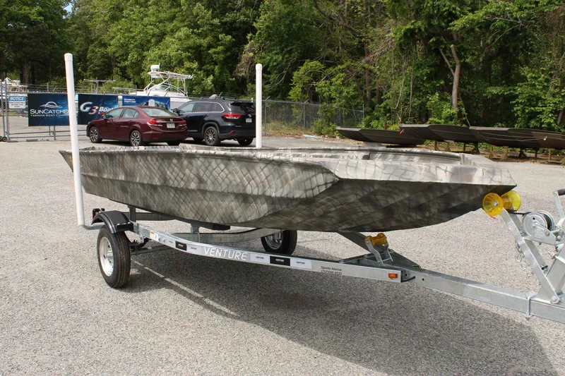Slide: The Image of WeldBilt 1552V boat from 2026 parked on trailer outdoors. - 7